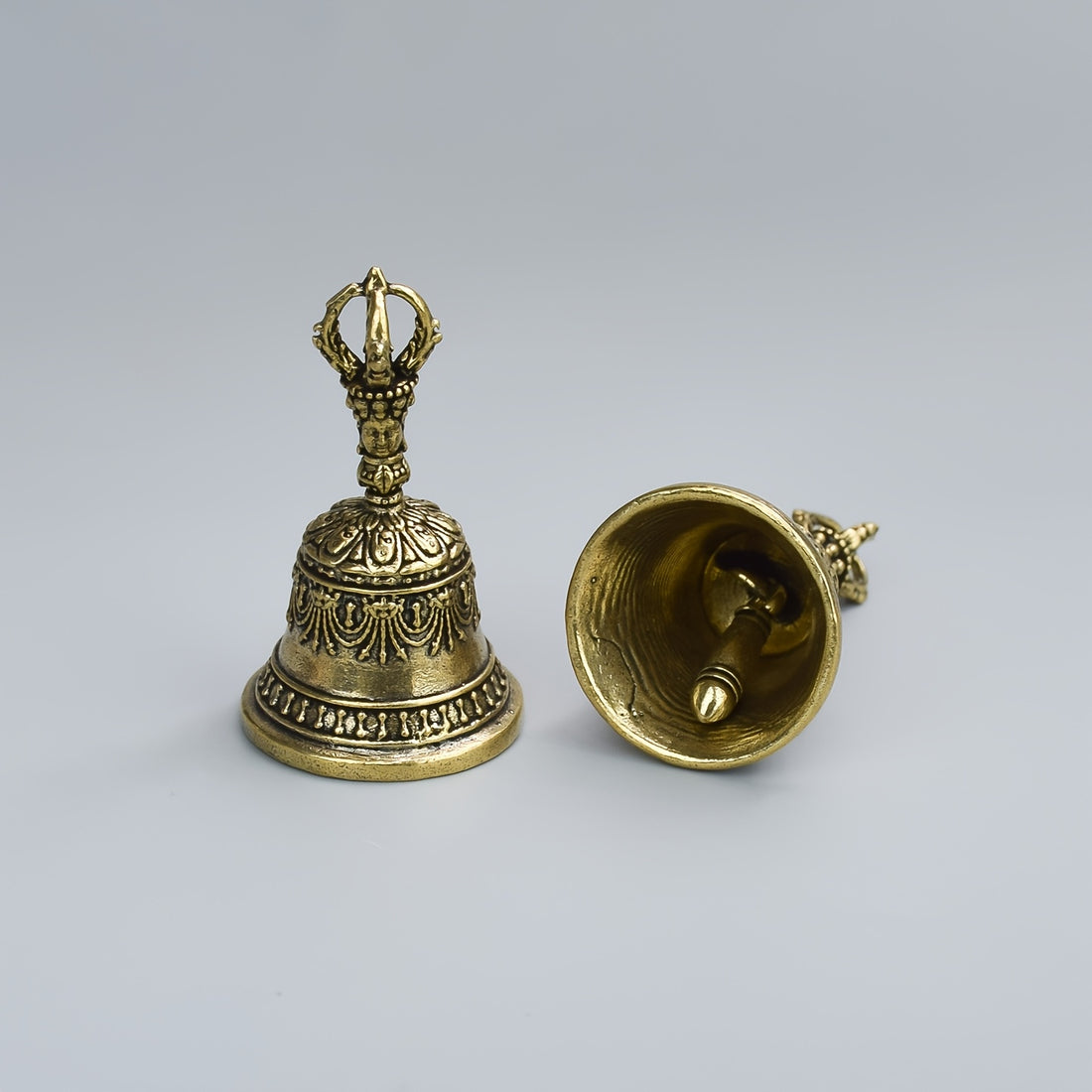one carved bronze bell hand held shaker clapping handle
