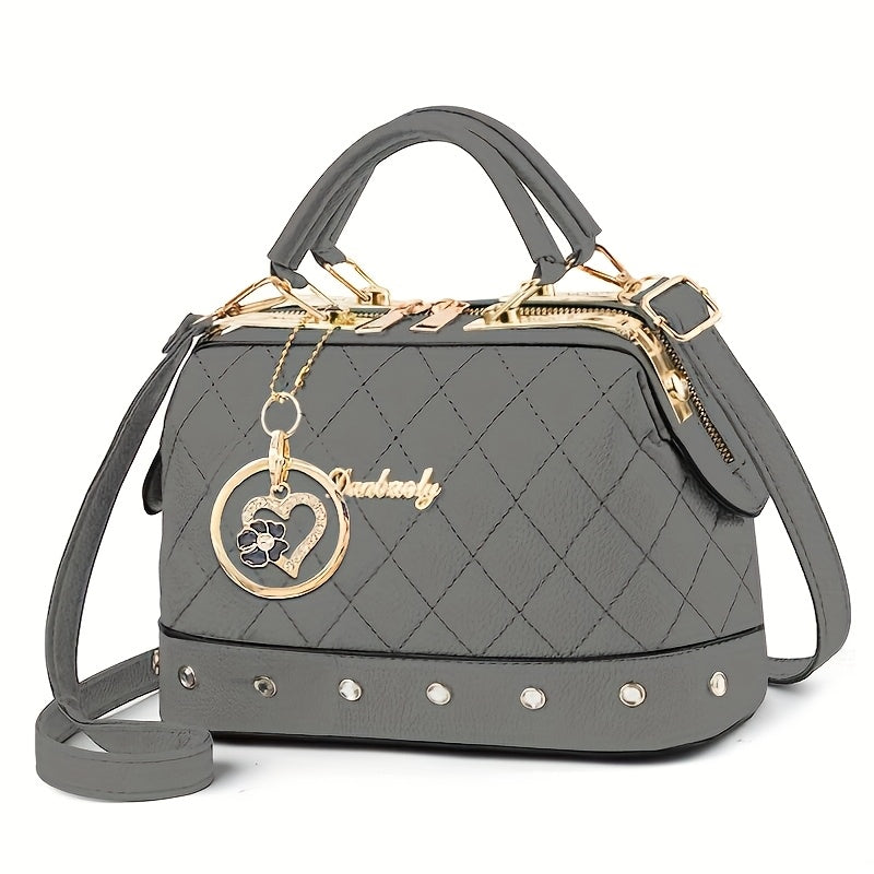 black quilted boston bag   adjustable shoulder