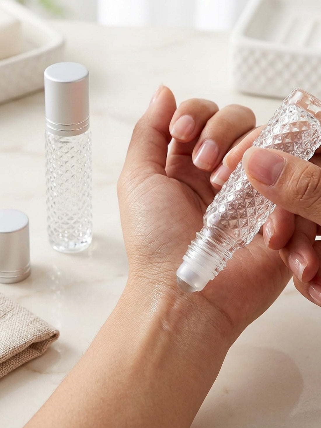 two refillable glass ball bottles designed cosmetics